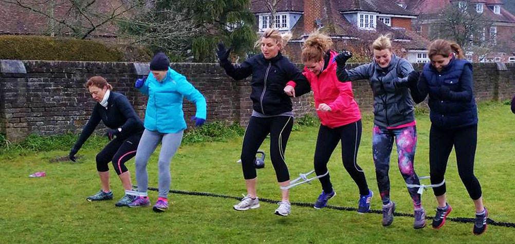 Three legged race at Moyles Court in the New Forest Hampshire doing personal training