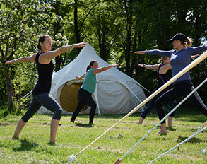 yoga outside glamping lotus belle tents