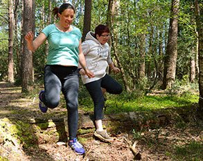 jumping a log in the new forest while excercising
